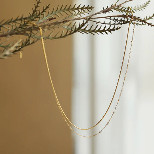 Strand. Necklace worn