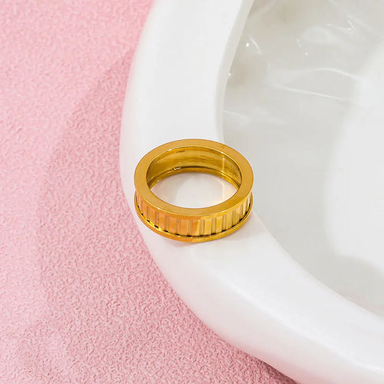 Cog. Ring worn